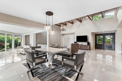 A well-designed home on a quiet street in desirable Seagate on Seagate Country Club in Florida - for sale on GolfHomes.com, golf home, golf lot