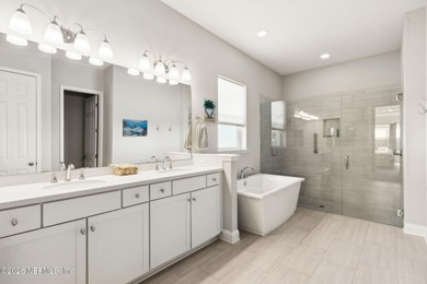 Live where every day feels like a getaway in this beautifully on Amelia National Golf and Country Club in Florida - for sale on GolfHomes.com, golf home, golf lot