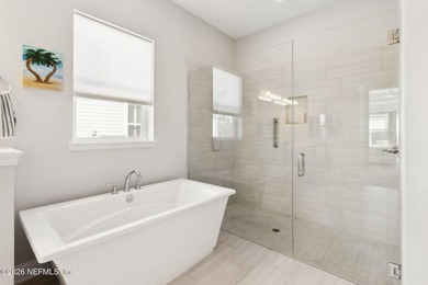 Live where every day feels like a getaway in this beautifully on Amelia National Golf and Country Club in Florida - for sale on GolfHomes.com, golf home, golf lot