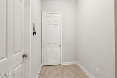 Live where every day feels like a getaway in this beautifully on Amelia National Golf and Country Club in Florida - for sale on GolfHomes.com, golf home, golf lot