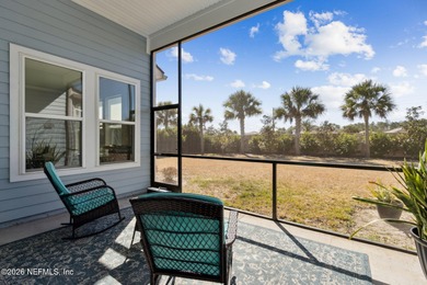 Live where every day feels like a getaway in this beautifully on Amelia National Golf and Country Club in Florida - for sale on GolfHomes.com, golf home, golf lot