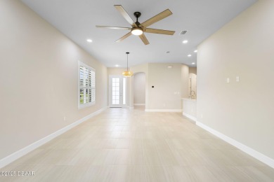 Step into easy living in Plantation Bay! This stylish 2-bedroom on Plantation Bay Golf and Country Club in Florida - for sale on GolfHomes.com, golf home, golf lot