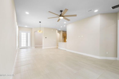 Step into easy living in Plantation Bay! This stylish 2-bedroom on Plantation Bay Golf and Country Club in Florida - for sale on GolfHomes.com, golf home, golf lot