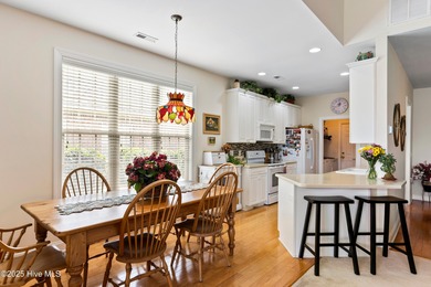 Discover the epitome of luxury living in this stunning end-unit on Lennon Hills Golf Course in North Carolina - for sale on GolfHomes.com, golf home, golf lot