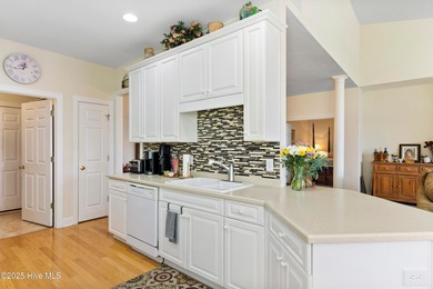 Discover the epitome of luxury living in this stunning end-unit on Lennon Hills Golf Course in North Carolina - for sale on GolfHomes.com, golf home, golf lot