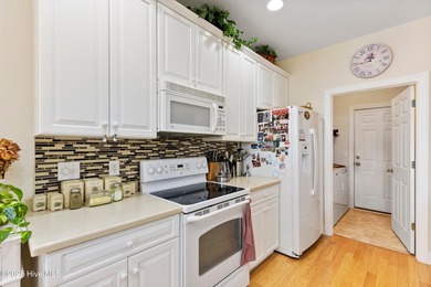 Discover the epitome of luxury living in this stunning end-unit on Lennon Hills Golf Course in North Carolina - for sale on GolfHomes.com, golf home, golf lot