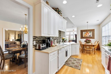 Discover the epitome of luxury living in this stunning end-unit on Lennon Hills Golf Course in North Carolina - for sale on GolfHomes.com, golf home, golf lot