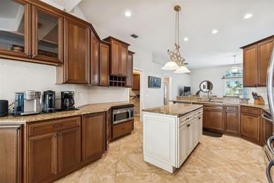 Step into this beautifully updated 4-bedroom, 2-bath home in the on Tampa Palms Golf and Country Club in Florida - for sale on GolfHomes.com, golf home, golf lot