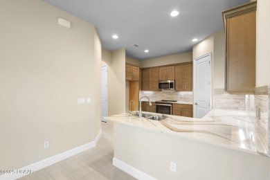 Step into easy living in Plantation Bay! This stylish 2-bedroom on Plantation Bay Golf and Country Club in Florida - for sale on GolfHomes.com, golf home, golf lot