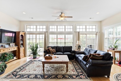 Discover the epitome of luxury living in this stunning end-unit on Lennon Hills Golf Course in North Carolina - for sale on GolfHomes.com, golf home, golf lot