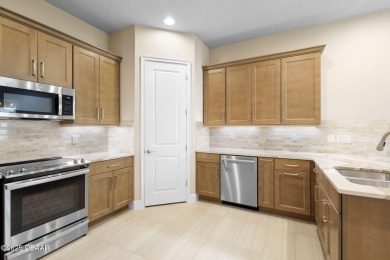 Step into easy living in Plantation Bay! This stylish 2-bedroom on Plantation Bay Golf and Country Club in Florida - for sale on GolfHomes.com, golf home, golf lot