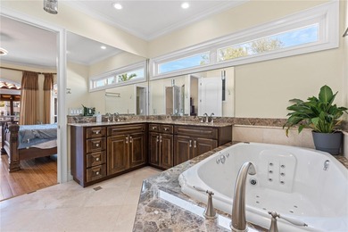 Welcome to an exceptional coastal retreat offering 5 bedrooms, 4 on Rocky Point Golf Course in Florida - for sale on GolfHomes.com, golf home, golf lot