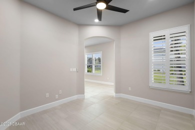 Step into easy living in Plantation Bay! This stylish 2-bedroom on Plantation Bay Golf and Country Club in Florida - for sale on GolfHomes.com, golf home, golf lot
