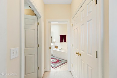 Discover the epitome of luxury living in this stunning end-unit on Lennon Hills Golf Course in North Carolina - for sale on GolfHomes.com, golf home, golf lot