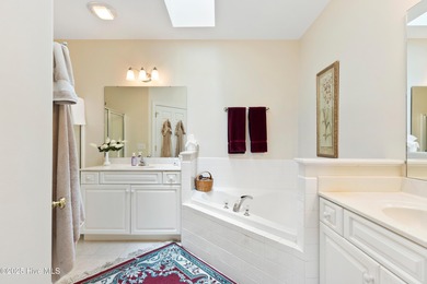 Discover the epitome of luxury living in this stunning end-unit on Lennon Hills Golf Course in North Carolina - for sale on GolfHomes.com, golf home, golf lot