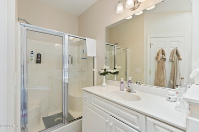 Discover the epitome of luxury living in this stunning end-unit on Lennon Hills Golf Course in North Carolina - for sale on GolfHomes.com, golf home, golf lot