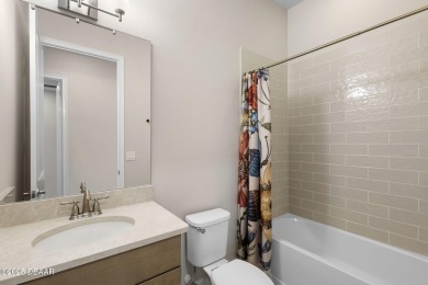Step into easy living in Plantation Bay! This stylish 2-bedroom on Plantation Bay Golf and Country Club in Florida - for sale on GolfHomes.com, golf home, golf lot