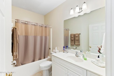 Discover the epitome of luxury living in this stunning end-unit on Lennon Hills Golf Course in North Carolina - for sale on GolfHomes.com, golf home, golf lot