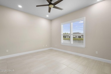 Step into easy living in Plantation Bay! This stylish 2-bedroom on Plantation Bay Golf and Country Club in Florida - for sale on GolfHomes.com, golf home, golf lot