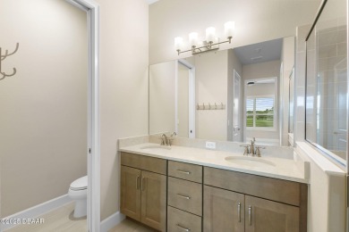 Step into easy living in Plantation Bay! This stylish 2-bedroom on Plantation Bay Golf and Country Club in Florida - for sale on GolfHomes.com, golf home, golf lot