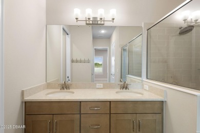 Step into easy living in Plantation Bay! This stylish 2-bedroom on Plantation Bay Golf and Country Club in Florida - for sale on GolfHomes.com, golf home, golf lot