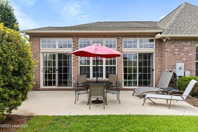 Discover the epitome of luxury living in this stunning end-unit on Lennon Hills Golf Course in North Carolina - for sale on GolfHomes.com, golf home, golf lot