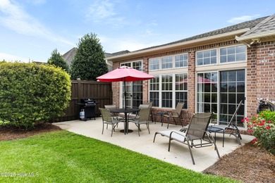 Discover the epitome of luxury living in this stunning end-unit on Lennon Hills Golf Course in North Carolina - for sale on GolfHomes.com, golf home, golf lot