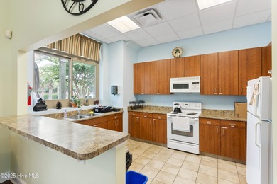 Discover the epitome of luxury living in this stunning end-unit on Lennon Hills Golf Course in North Carolina - for sale on GolfHomes.com, golf home, golf lot