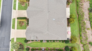 Discover the epitome of luxury living in this stunning end-unit on Lennon Hills Golf Course in North Carolina - for sale on GolfHomes.com, golf home, golf lot