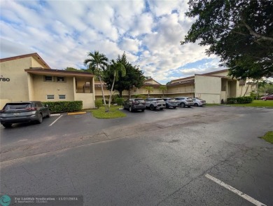 Just Reduced! This beautifully renovated 3-bedroom, 2-bathroom on Woodmont Country Club in Florida - for sale on GolfHomes.com, golf home, golf lot