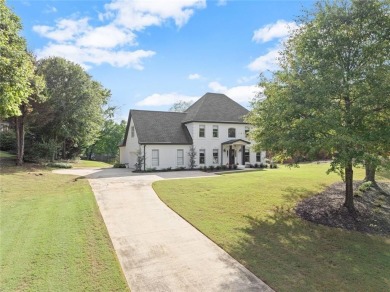 Absolutely stunning two-story home situated on the 6th fairway on Royal Lakes Golf and Country Club in Georgia - for sale on GolfHomes.com, golf home, golf lot