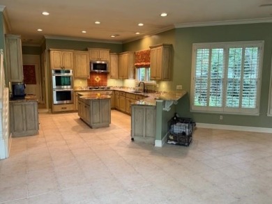 A fee is extra for membership to TPC Clubhouse, including dining on TPC at Southwind in Tennessee - for sale on GolfHomes.com, golf home, golf lot