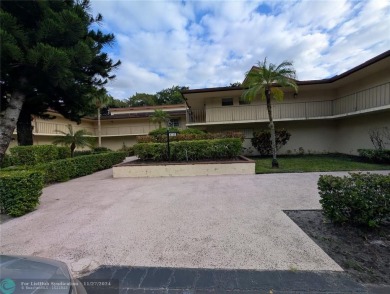 Just Reduced! This beautifully renovated 3-bedroom, 2-bathroom on Woodmont Country Club in Florida - for sale on GolfHomes.com, golf home, golf lot