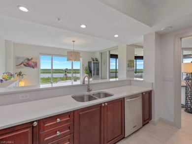 Experience refined coastal living in this elegant residence at on Hammock Bay in Florida - for sale on GolfHomes.com, golf home, golf lot