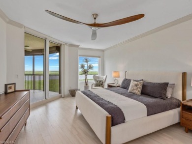 Experience refined coastal living in this elegant residence at on Hammock Bay in Florida - for sale on GolfHomes.com, golf home, golf lot