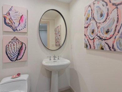 Experience refined coastal living in this elegant residence at on Hammock Bay in Florida - for sale on GolfHomes.com, golf home, golf lot
