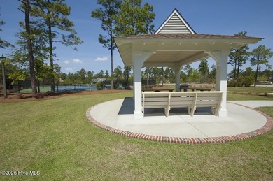 A private nicely wooded homesite in prestigious Rivers Edge Golf on Rivers Edge Golf Club in North Carolina - for sale on GolfHomes.com, golf home, golf lot