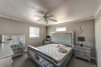 This well-proportioned home offers a formal dining room on Brentwood Country Club in New York - for sale on GolfHomes.com, golf home, golf lot
