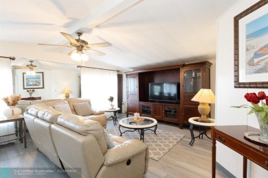 Step into this beautifully maintained 2-bedroom, 2-bath mobile on Vero Beach Country Club in Florida - for sale on GolfHomes.com, golf home, golf lot