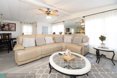 Step into this beautifully maintained 2-bedroom, 2-bath mobile on Vero Beach Country Club in Florida - for sale on GolfHomes.com, golf home, golf lot