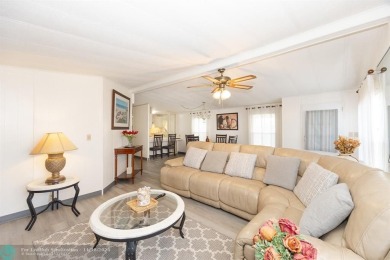 Step into this beautifully maintained 2-bedroom, 2-bath mobile on Vero Beach Country Club in Florida - for sale on GolfHomes.com, golf home, golf lot