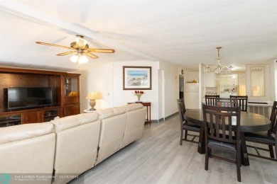 Step into this beautifully maintained 2-bedroom, 2-bath mobile on Vero Beach Country Club in Florida - for sale on GolfHomes.com, golf home, golf lot