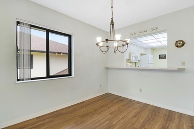 Enjoy panoramic golf and lake views from this 2 bedroom, 2 bath on  in Florida - for sale on GolfHomes.com, golf home, golf lot