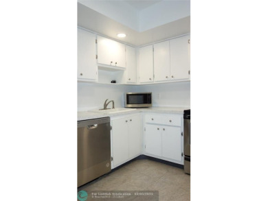 HUGE PRICE REDUCTION! This 5th-floor condo offers 1,500 square on Palm-Aire Country Club and Resort - The Oaks in Florida - for sale on GolfHomes.com, golf home, golf lot