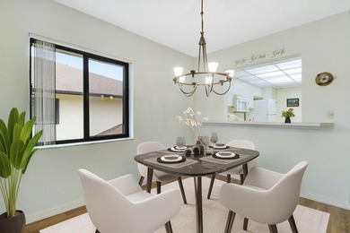 Enjoy panoramic golf and lake views from this 2 bedroom, 2 bath on  in Florida - for sale on GolfHomes.com, golf home, golf lot