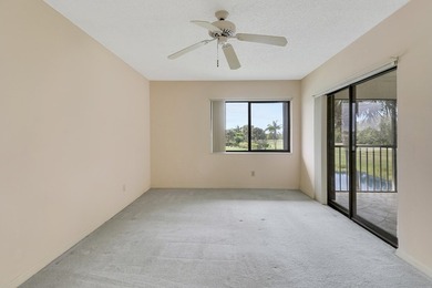 Enjoy panoramic golf and lake views from this 2 bedroom, 2 bath on  in Florida - for sale on GolfHomes.com, golf home, golf lot
