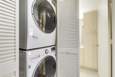 Enjoy panoramic golf and lake views from this 2 bedroom, 2 bath on  in Florida - for sale on GolfHomes.com, golf home, golf lot