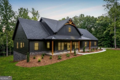 nWelcome to this stunning Craftsman home nestled on a beautiful on The Club River Forest in Georgia - for sale on GolfHomes.com, golf home, golf lot