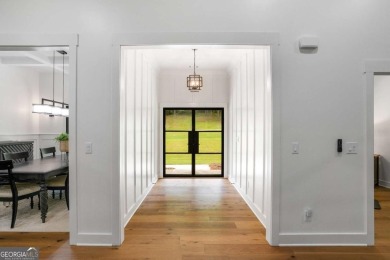 nWelcome to this stunning Craftsman home nestled on a beautiful on The Club River Forest in Georgia - for sale on GolfHomes.com, golf home, golf lot