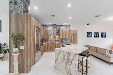 Welcome to this beautiful modern waterfront home with private on The Bears Club in Florida - for sale on GolfHomes.com, golf home, golf lot